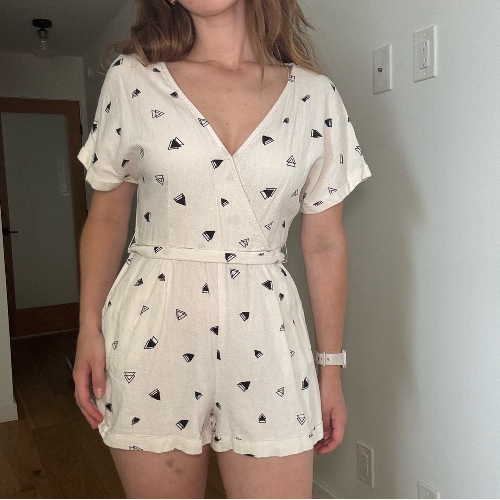 Cream and black romper with a wrap design